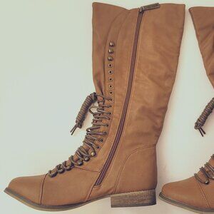 Fashionable healed mid range boot with soft leather